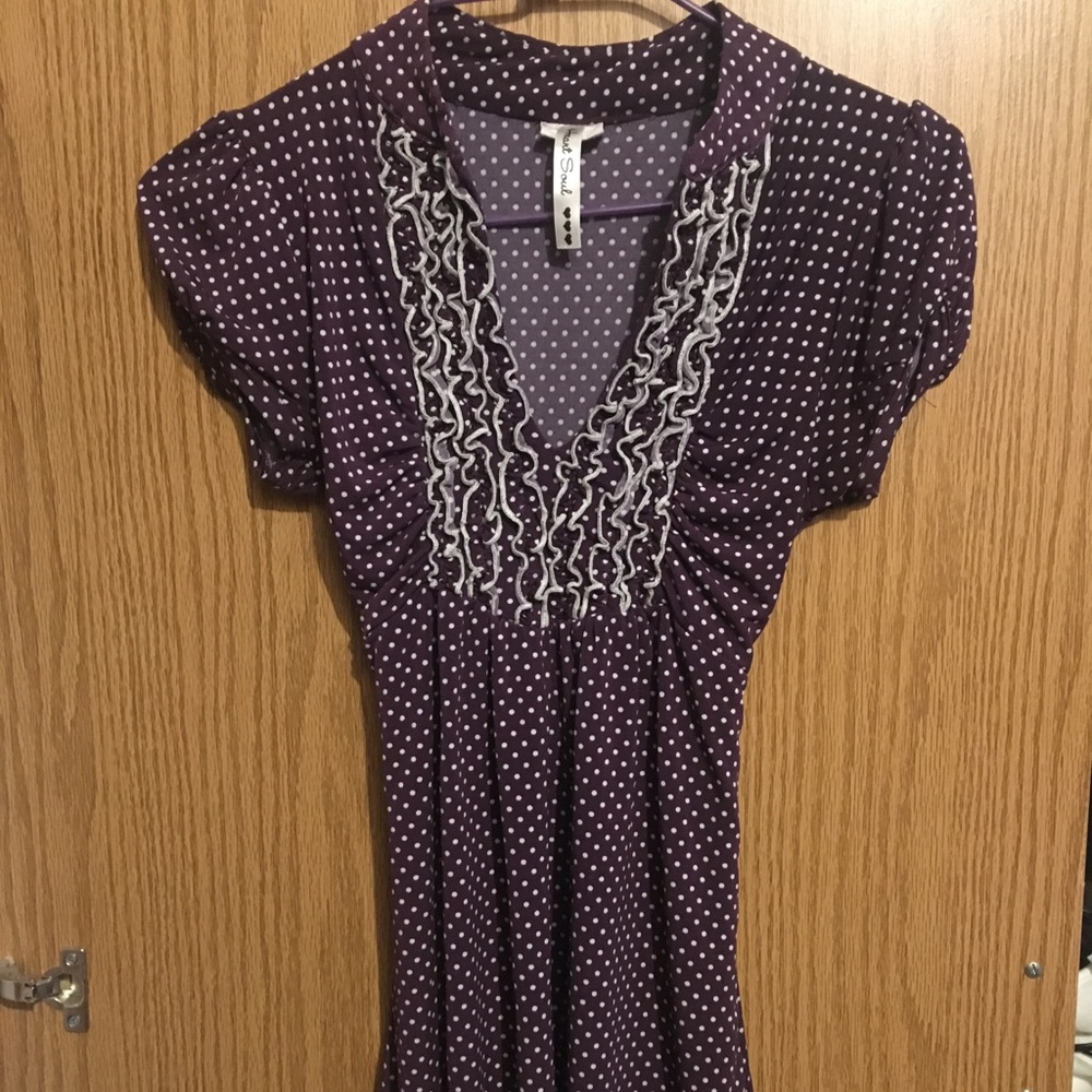 Purple and white polka dotted blouse
